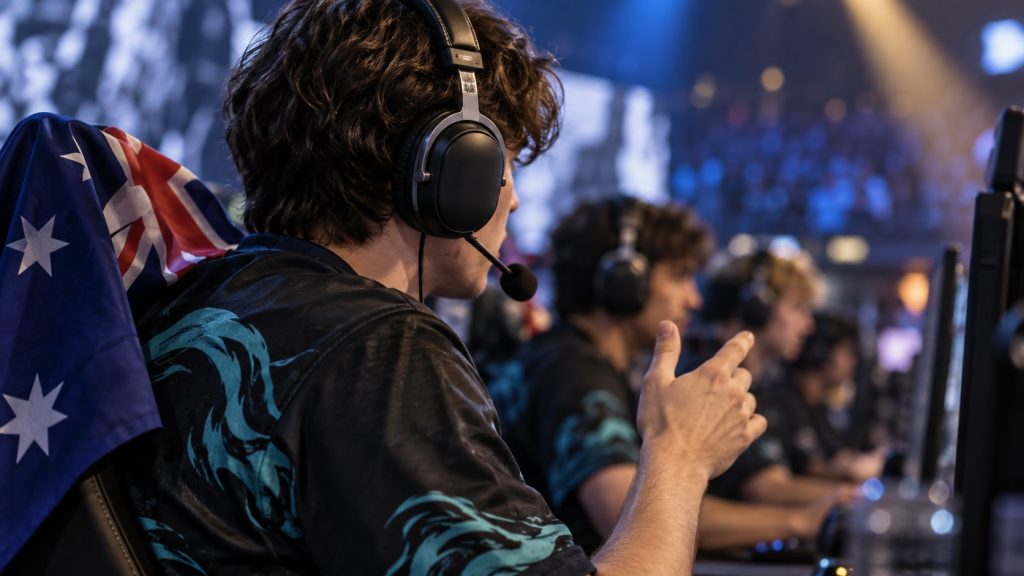 Illustrative anonymous Australian esports player communicating at a LAN, not an actual player